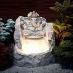 Ganesh Sitting on Stone Water Fountain with led light