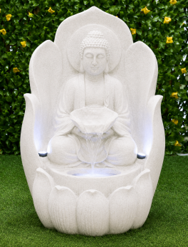 Buddha sitting on lotus flower water fountain