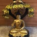 Brass Buddha Idol Under Tree