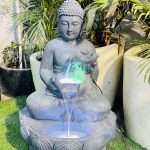 Buddha Sitting On Lotus With Hand Water Floating